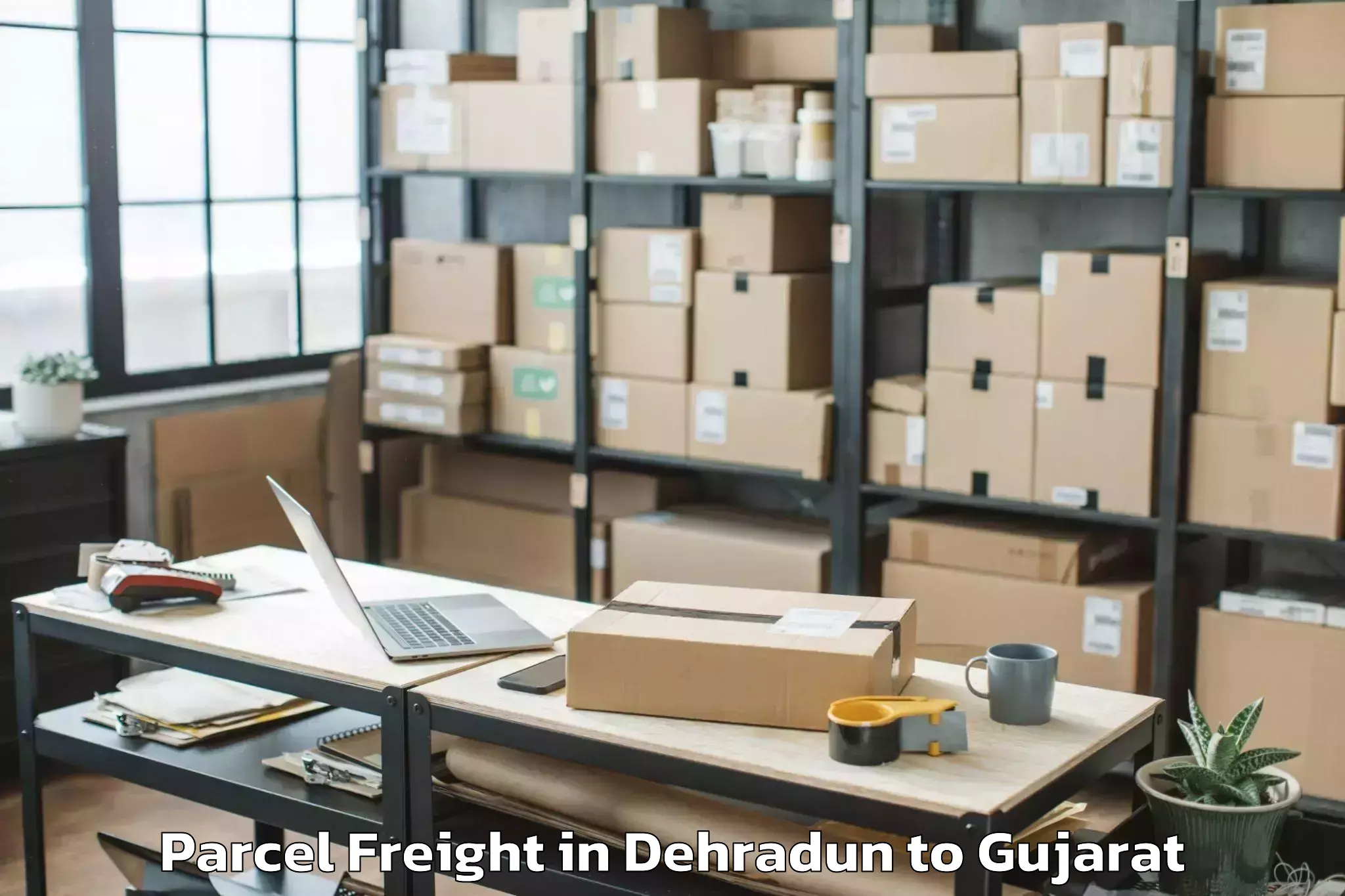 Dehradun to Lunavada Parcel Freight Booking